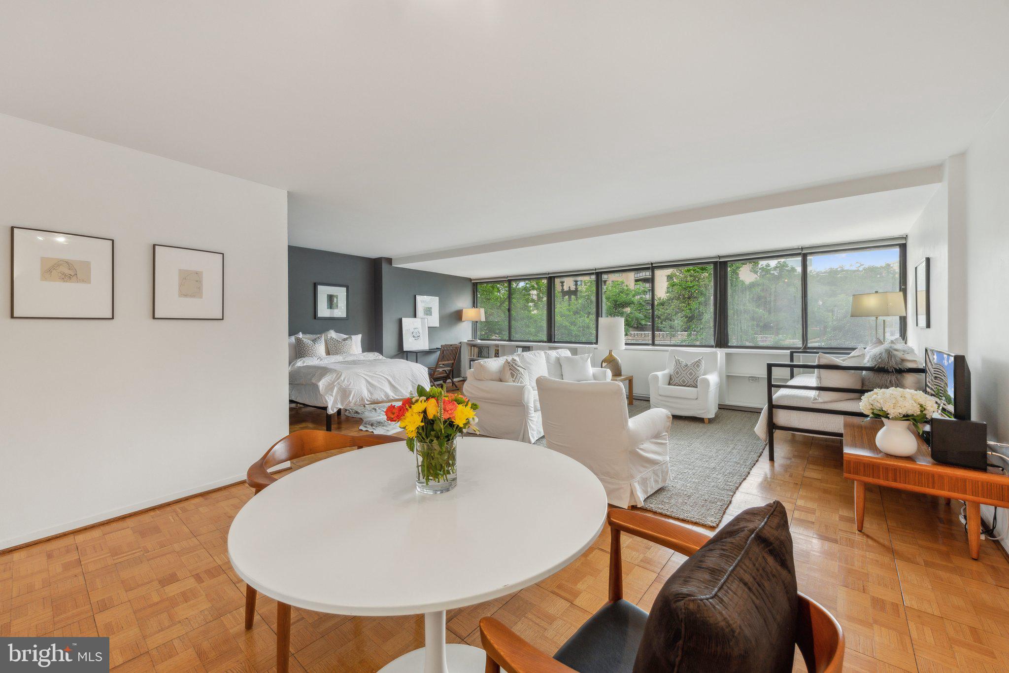 2510 Virginia Avenue Northwest, Unit 2BN Washington, DC 20037 - Photo 4 of 21 a living room with furniture and a wooden floor