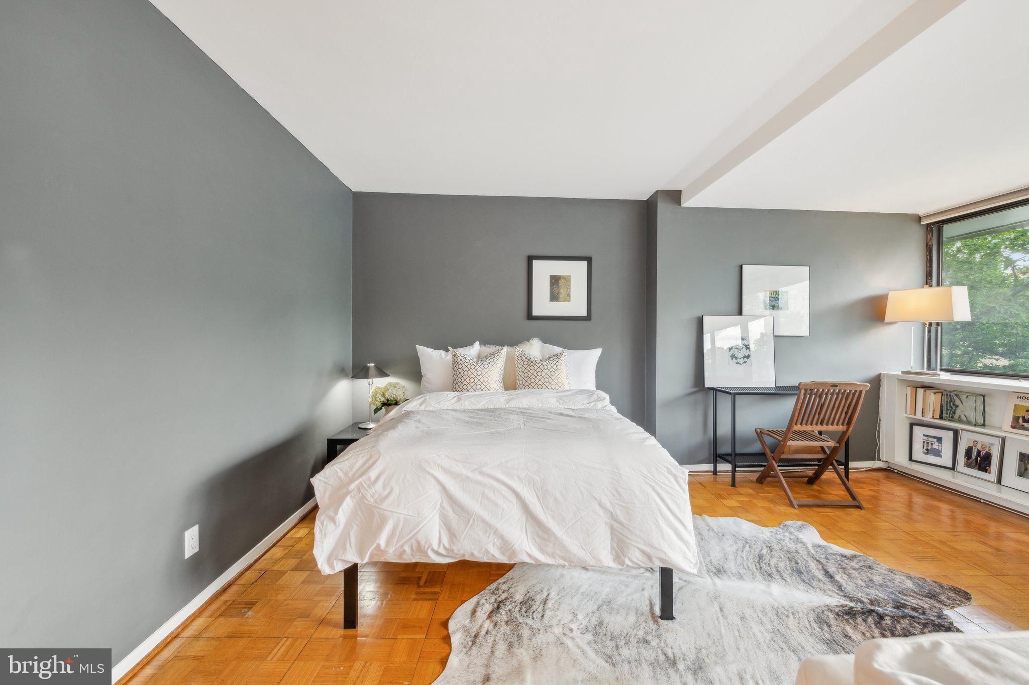 2510 Virginia Avenue Northwest, Unit 2BN Washington, DC 20037 - Photo 5 of 21 a bed room with a bed window and a table