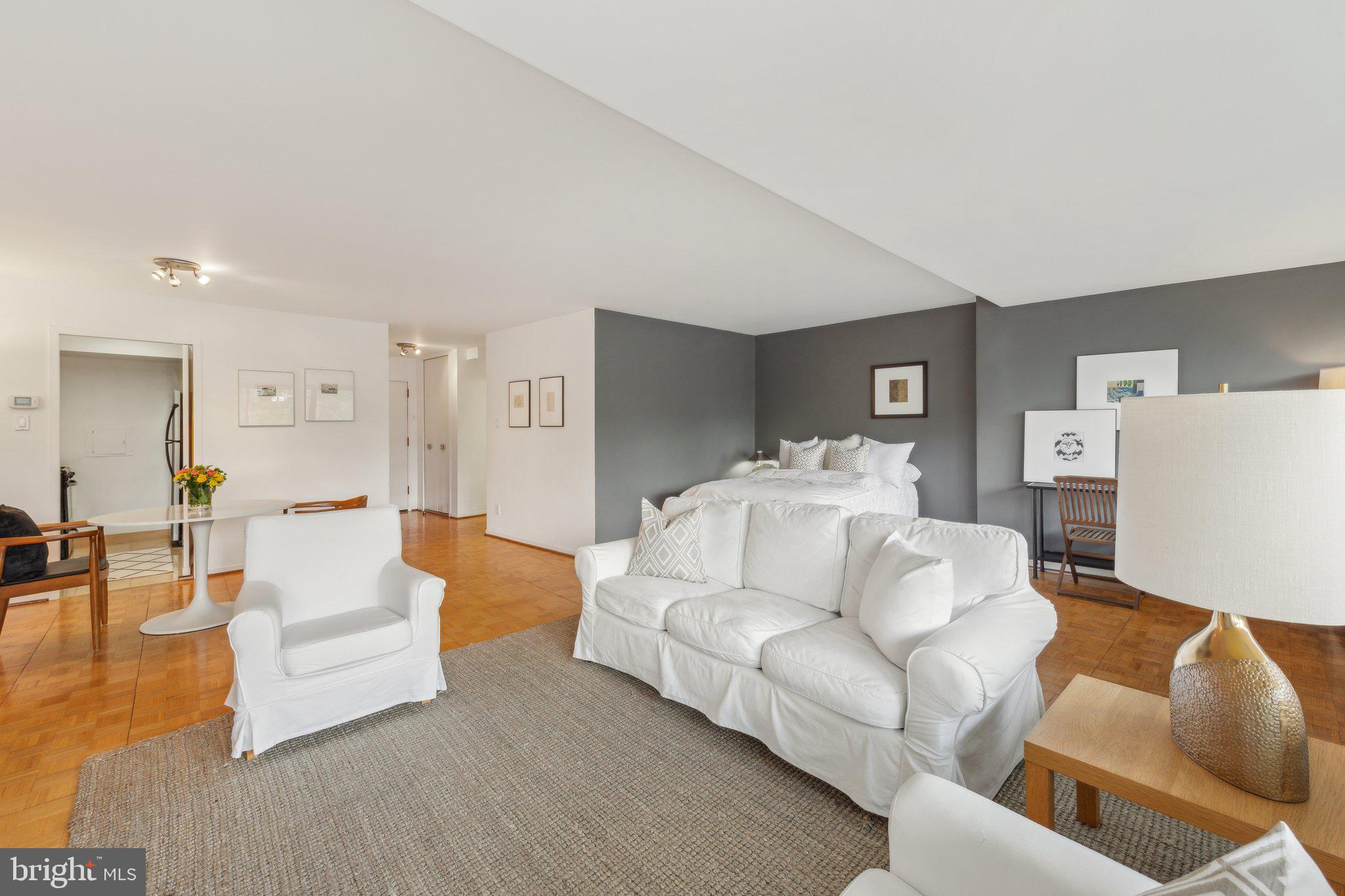 2510 Virginia Avenue Northwest, Unit 2BN Washington, DC 20037 - Photo 9 of 21 a living room with furniture and a table