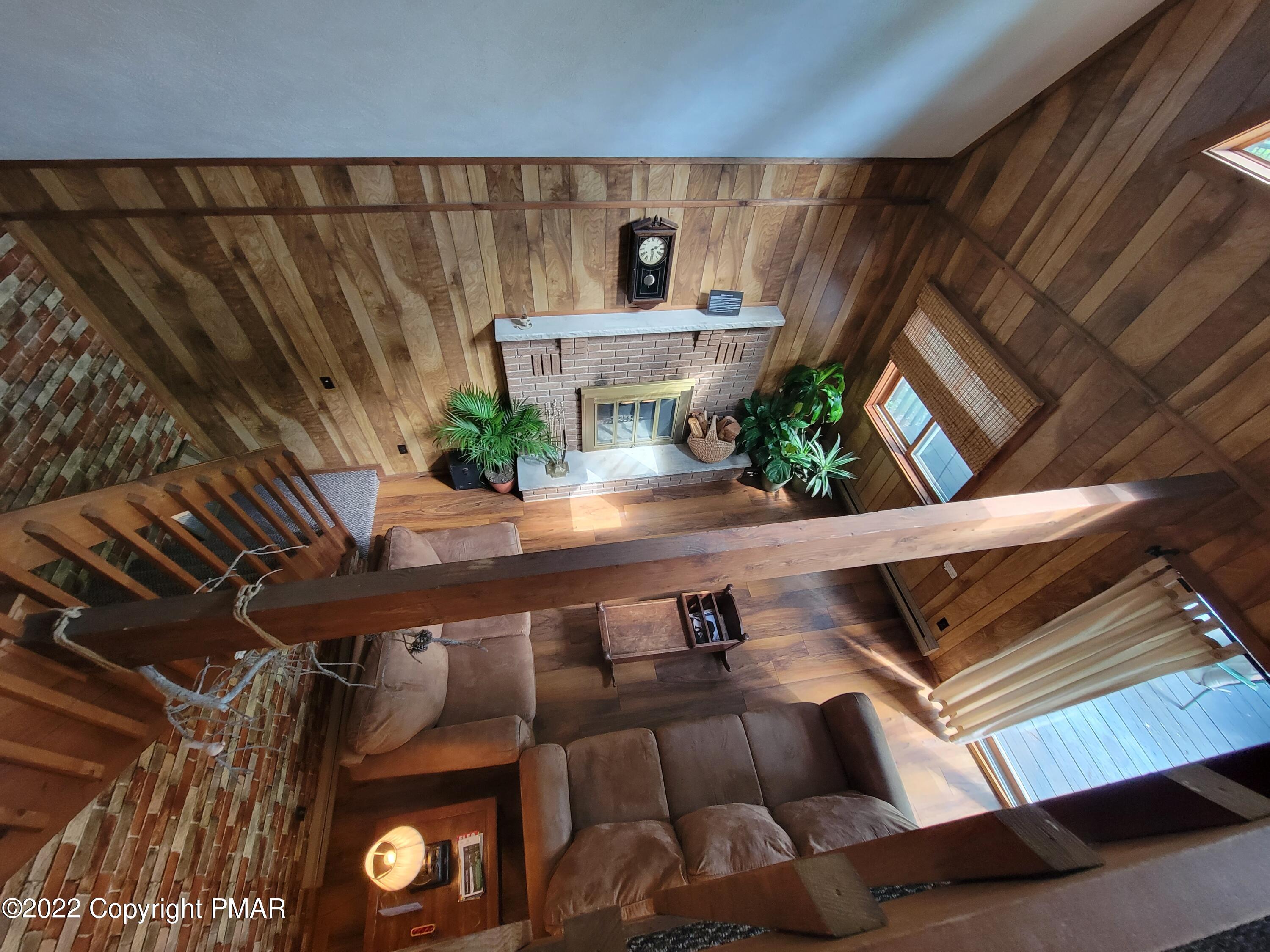 358 Brentwood Drive Bushkill, PA 18324 - Photo 13 of 59 a view of living room with furniture and wooden floor