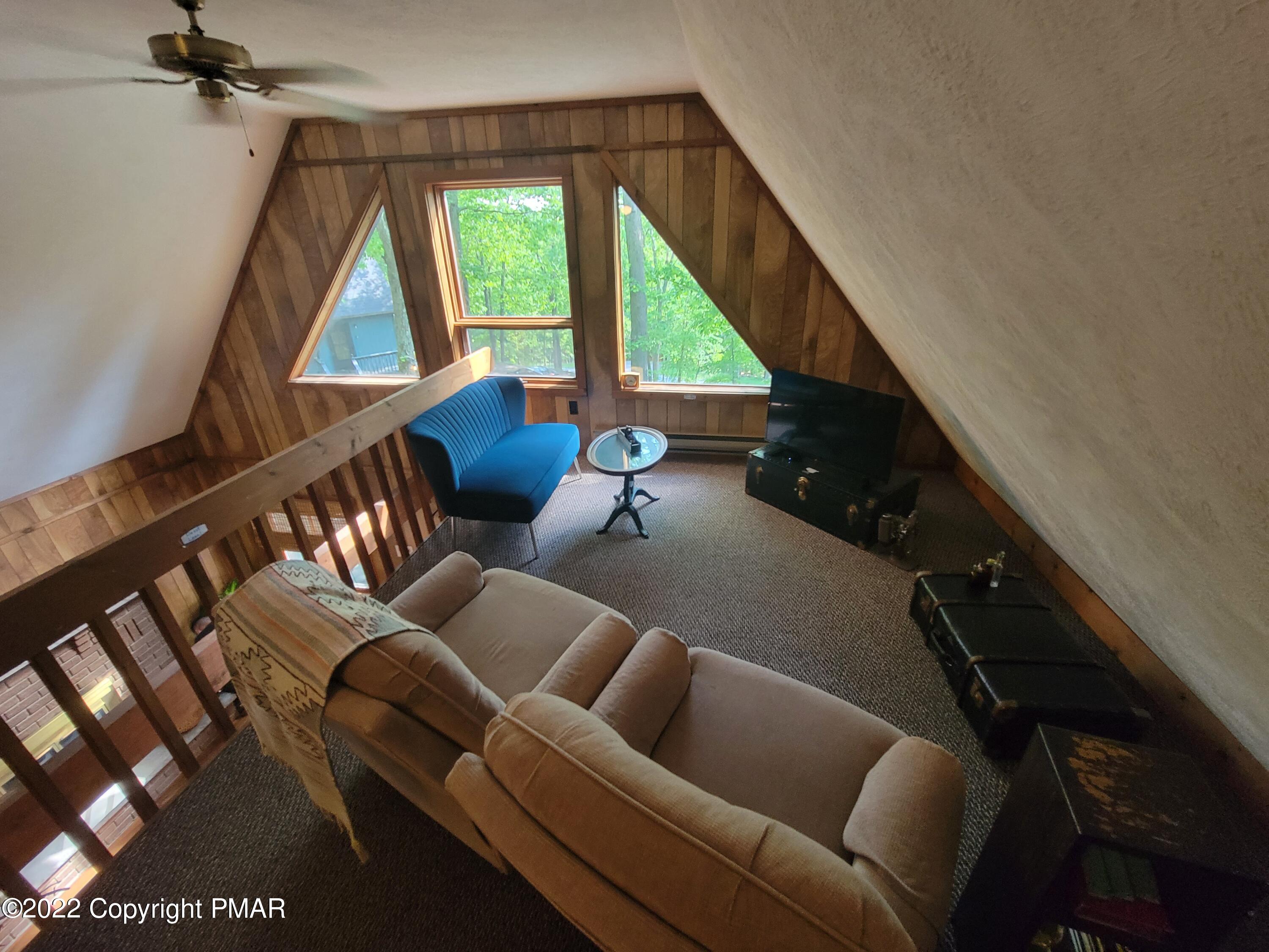 358 Brentwood Drive Bushkill, PA 18324 - Photo 15 of 59 a living room with furniture and a large window