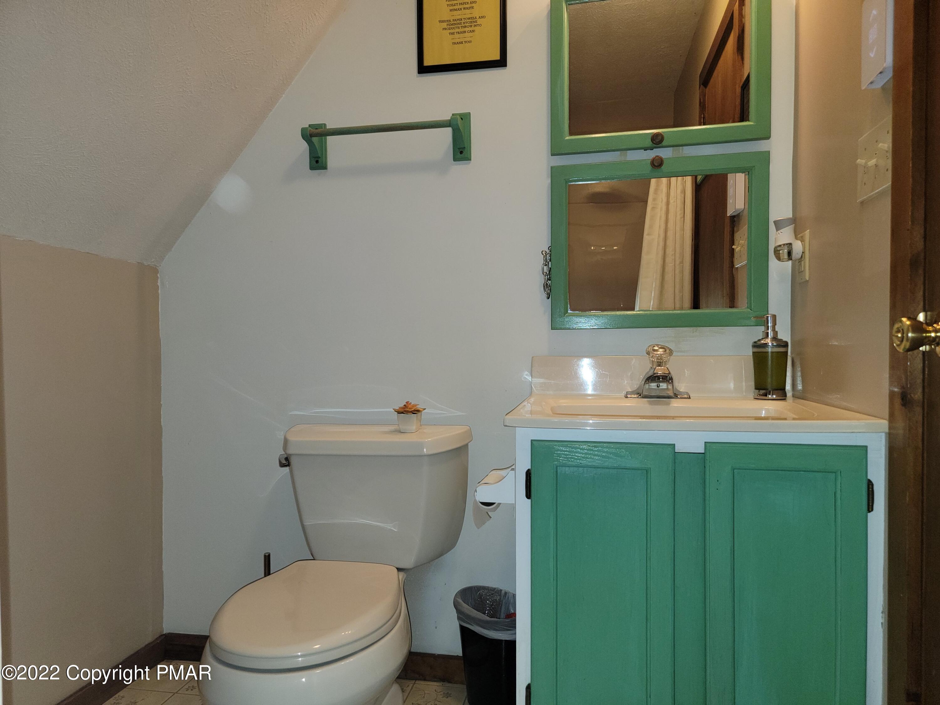 358 Brentwood Drive Bushkill, PA 18324 - Photo 22 of 59 a bathroom with a granite countertop toilet sink and mirror