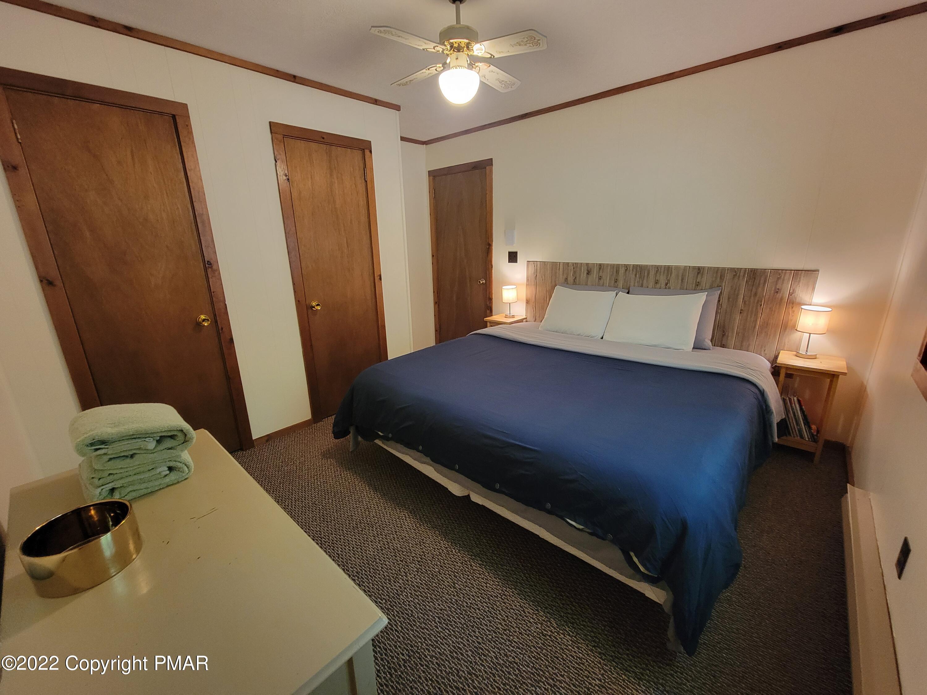 358 Brentwood Drive Bushkill, PA 18324 - Photo 25 of 59 a bedroom with a bed and a window