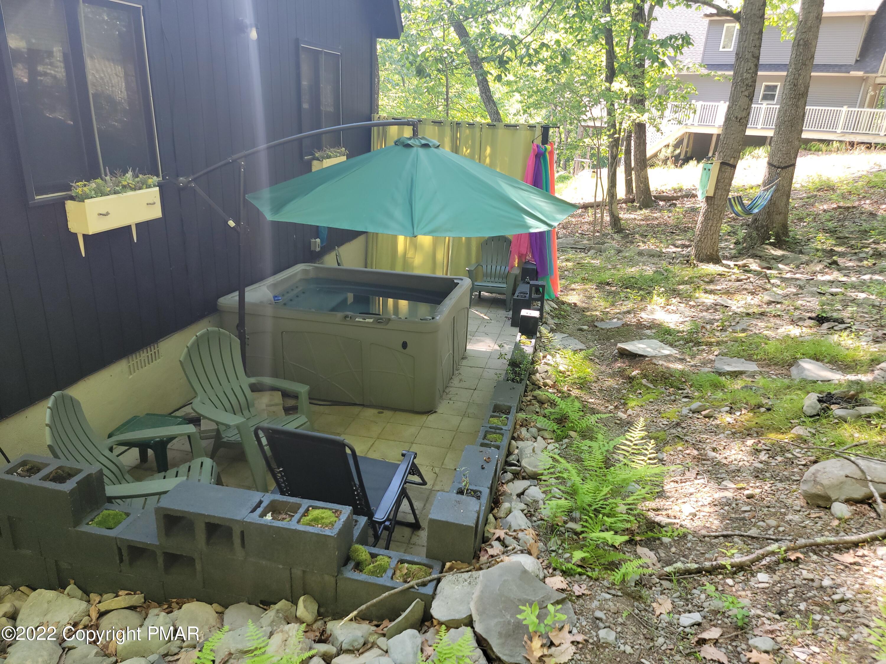 358 Brentwood Drive Bushkill, PA 18324 - Photo 36 of 59 a view of balcony with two chairs and a table