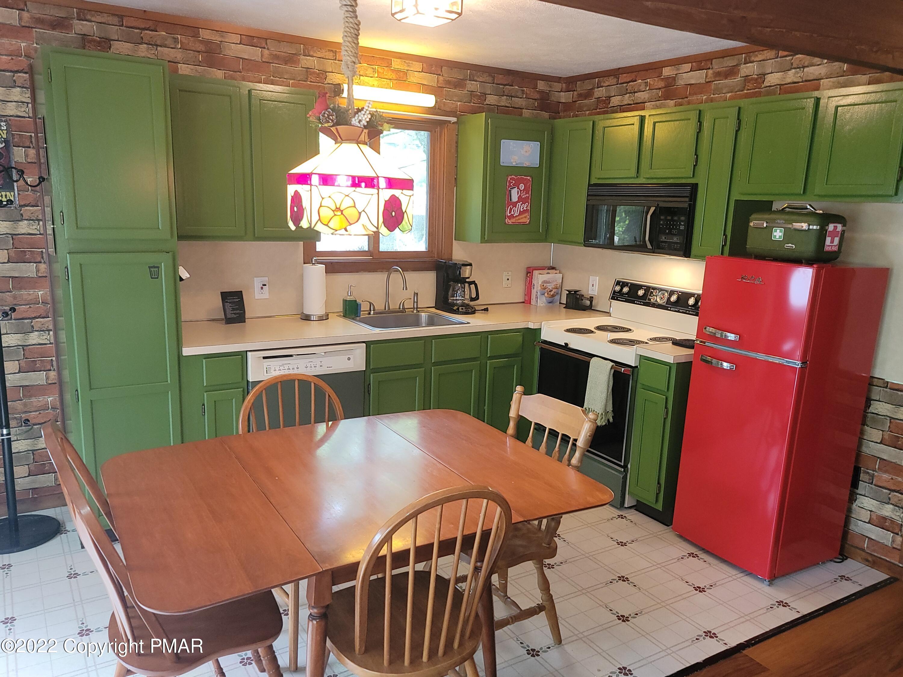 358 Brentwood Drive Bushkill, PA 18324 - Photo 4 of 59 a view of a dining room with furniture window and outside view