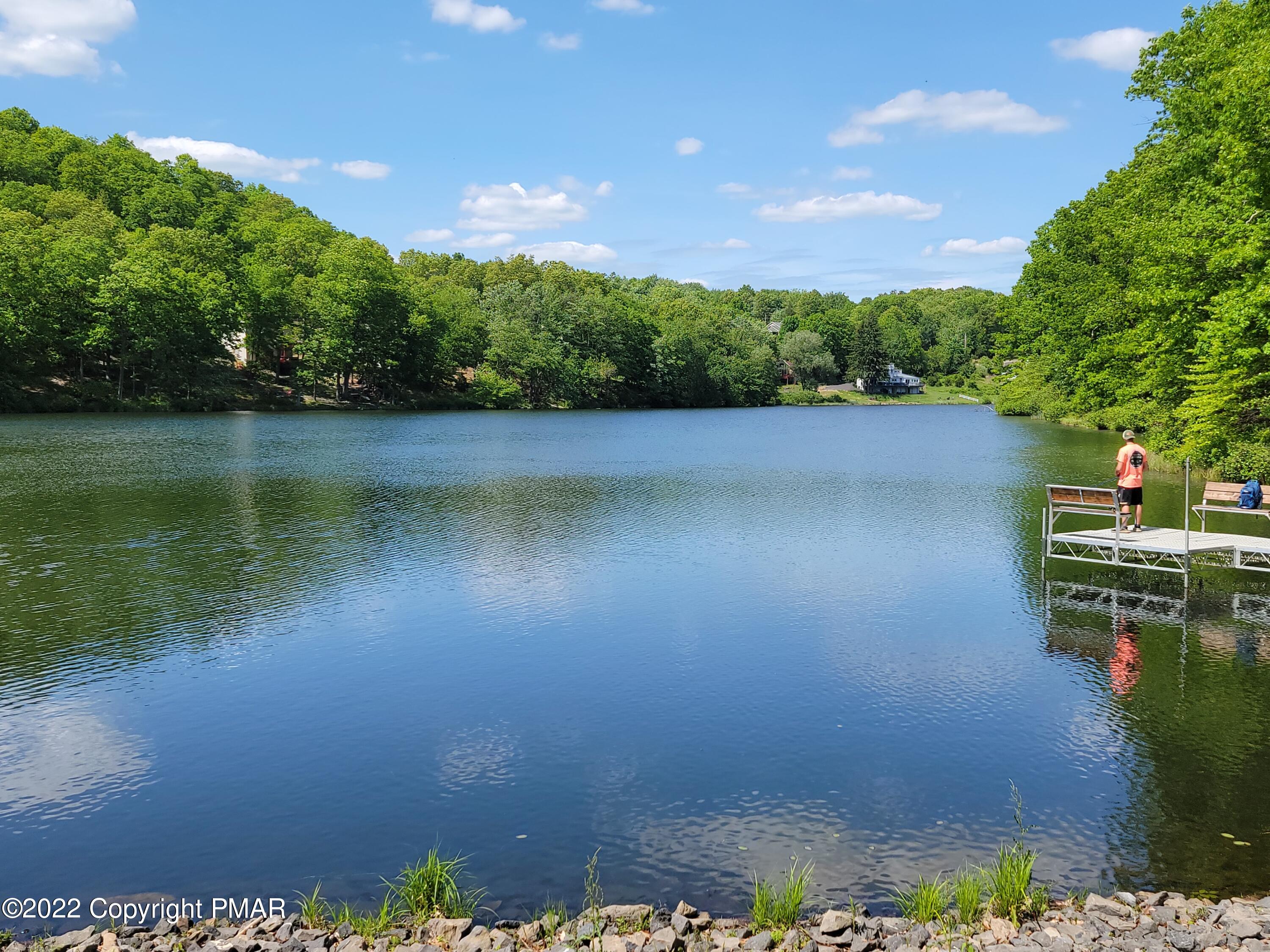 358 Brentwood Drive Bushkill, PA 18324 - Photo 47 of 59 a view of a lake with a yard