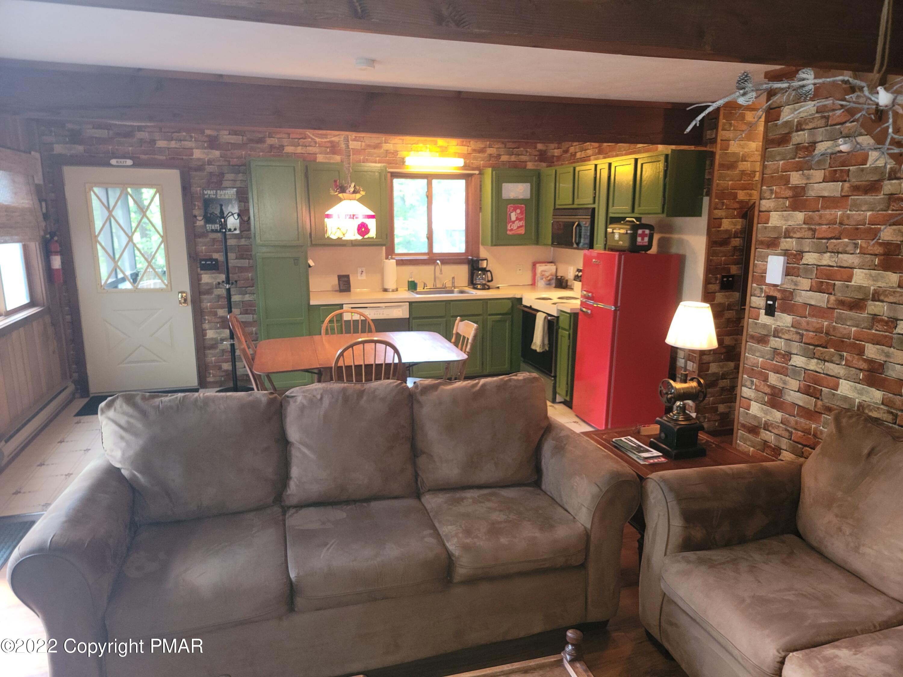 358 Brentwood Drive Bushkill, PA 18324 - Photo 5 of 59 a living room with furniture and a fireplace