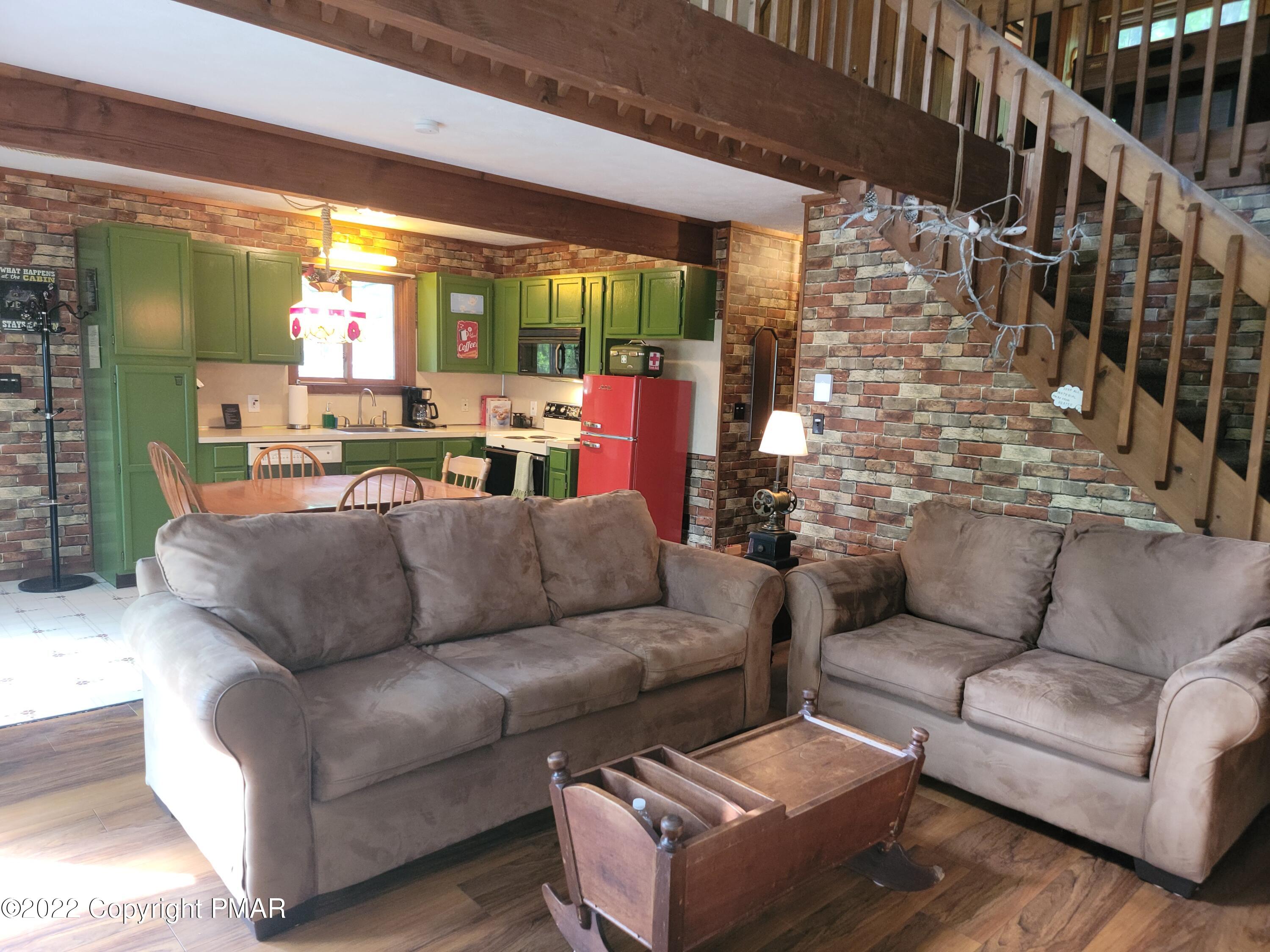 358 Brentwood Drive Bushkill, PA 18324 - Photo 6 of 59 a living room with furniture and a large window