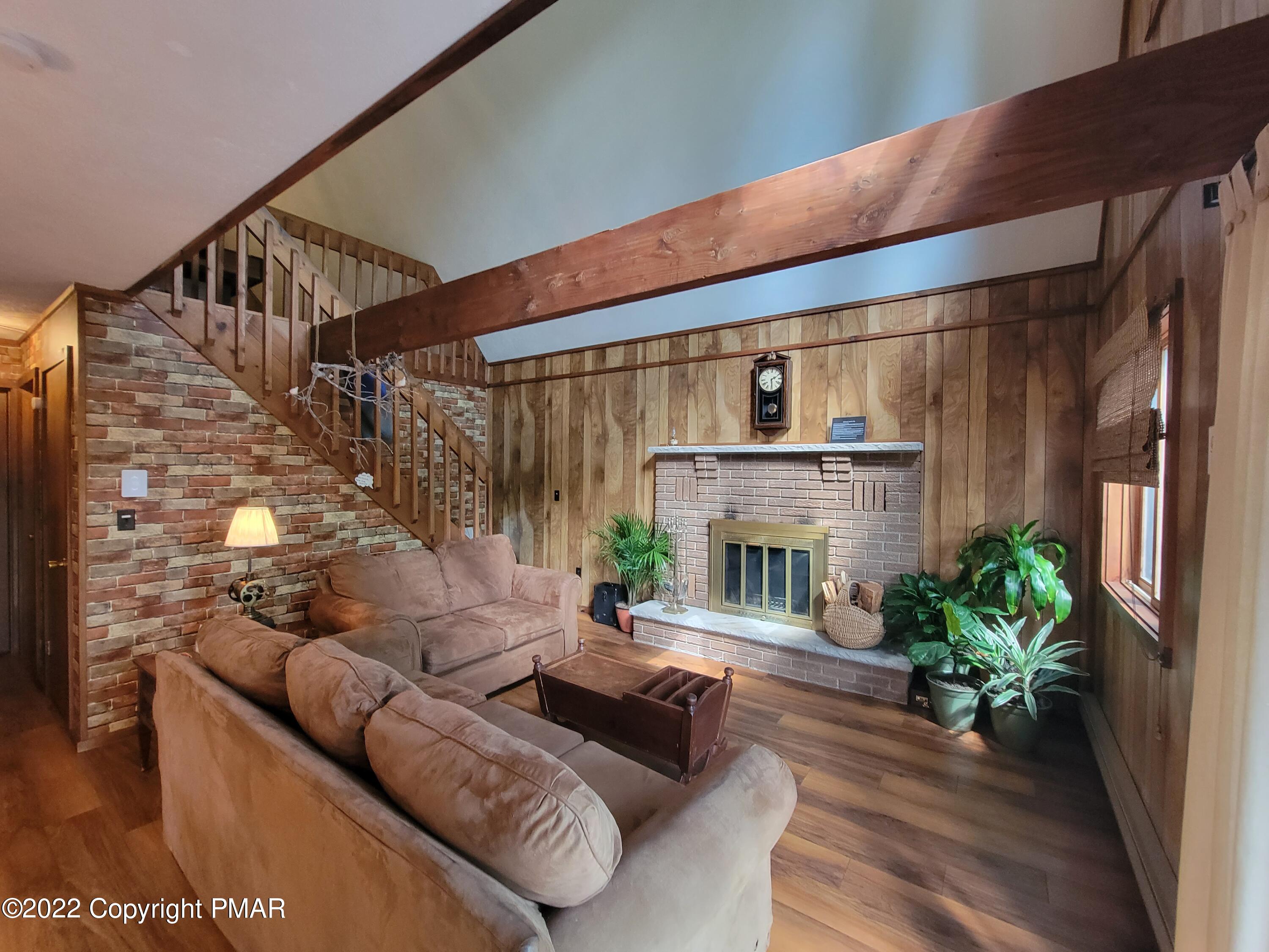 358 Brentwood Drive Bushkill, PA 18324 - Photo 8 of 59 a living room with furniture and a fireplace