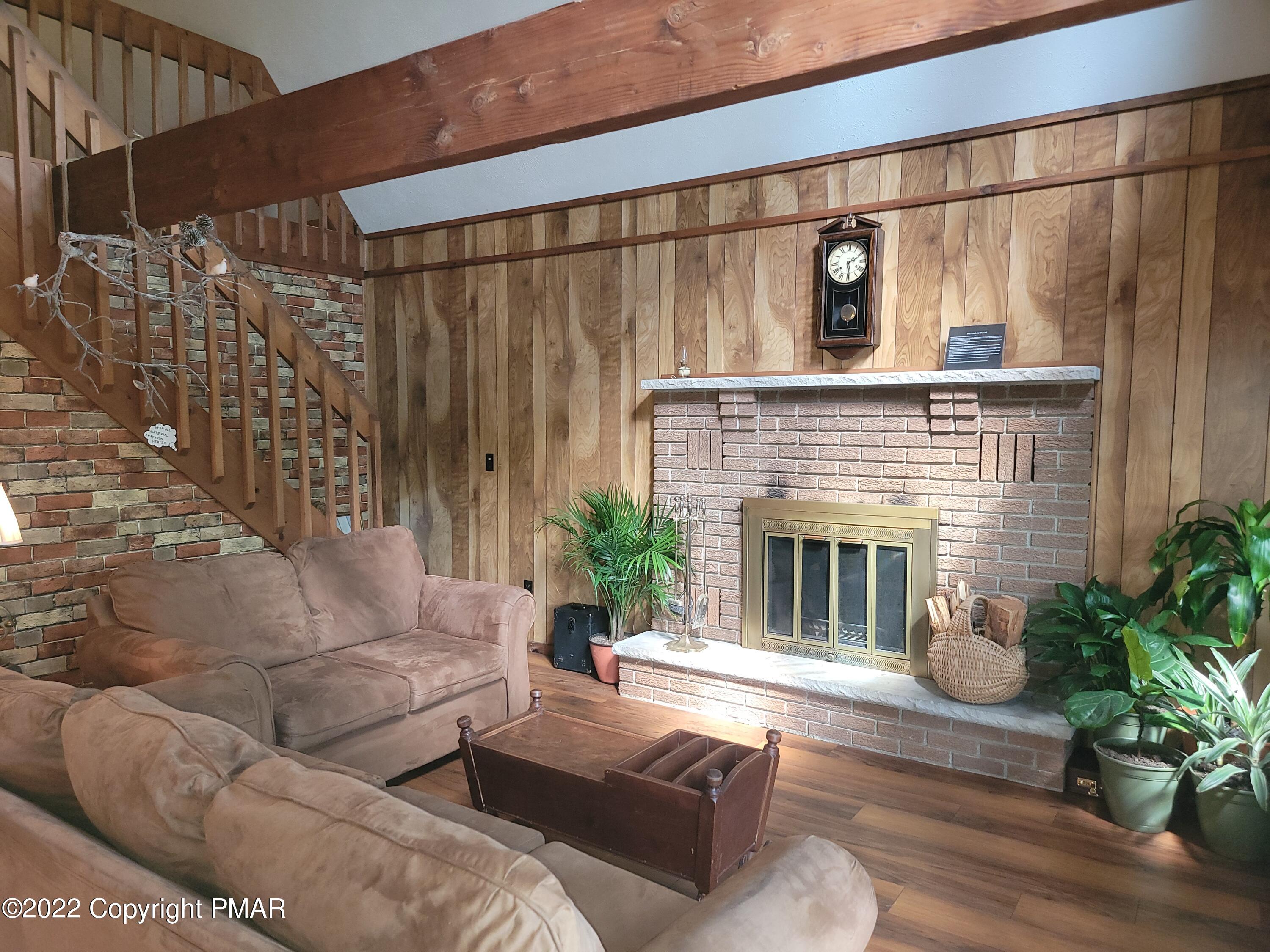 358 Brentwood Drive Bushkill, PA 18324 - Photo 10 of 59 a living room with furniture and a fireplace