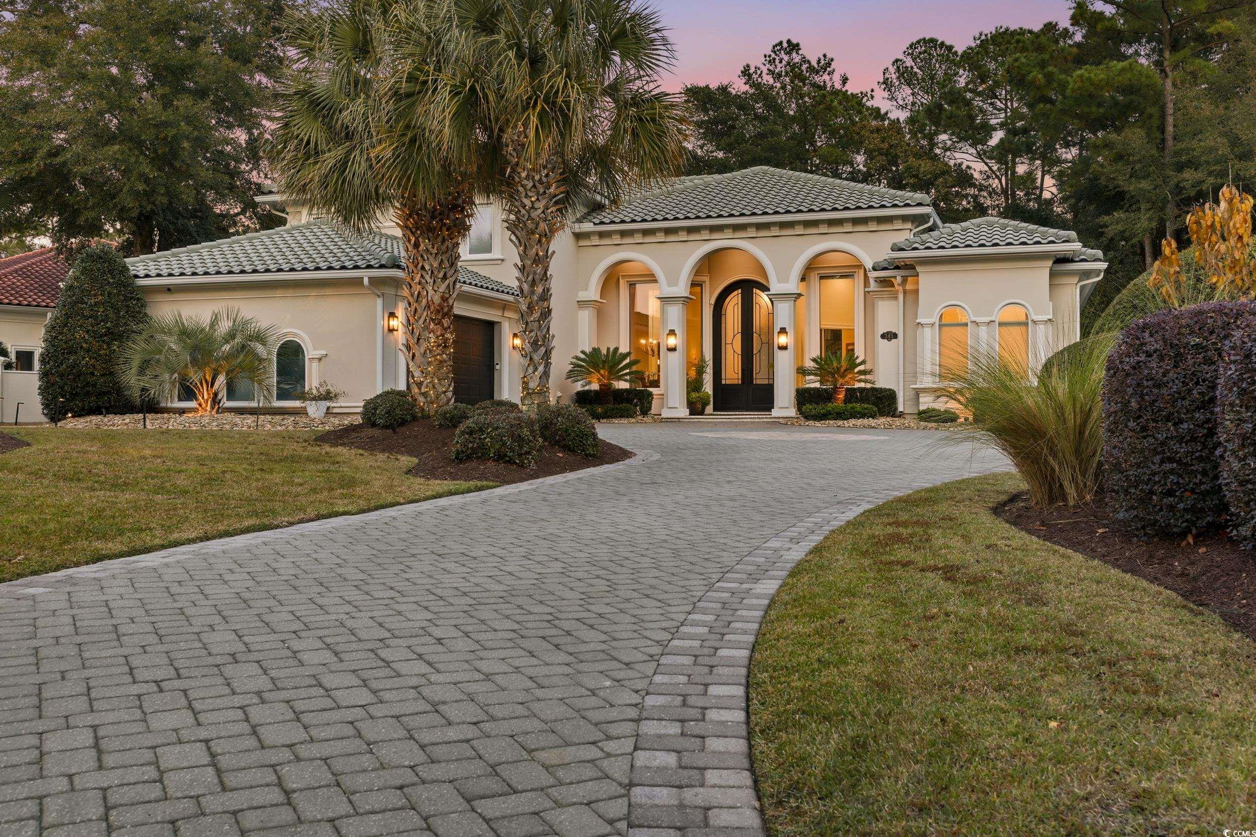 345 Posada Drive Myrtle Beach, SC 29572 - Photo 37 of 40 Mediterranean / spanish home with stucco siding, a front yard, decorative driveway, and a tiled roof