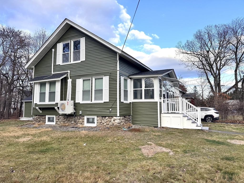 a front view of a house with a yard