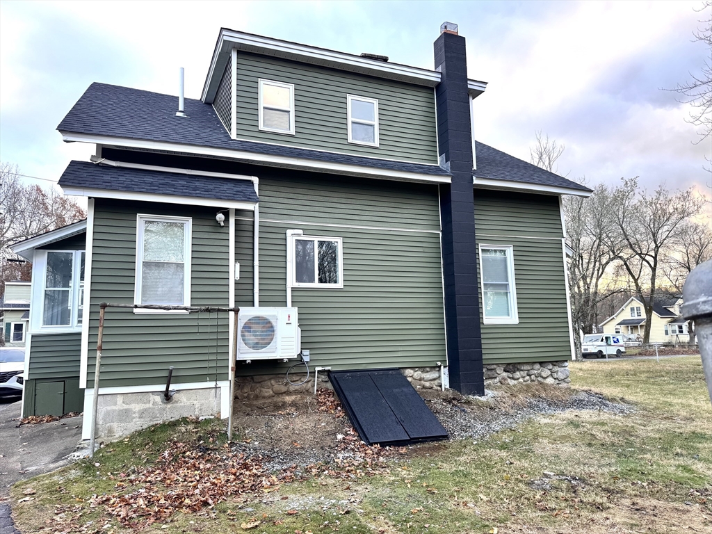 9 Idalla Avenue Worcester, MA 01606 - Photo 13 of 16 a brick house that has a small yard and large trees