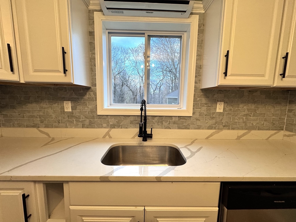 9 Idalla Avenue Worcester, MA 01606 - Photo 5 of 16 a kitchen with a sink and cabinets