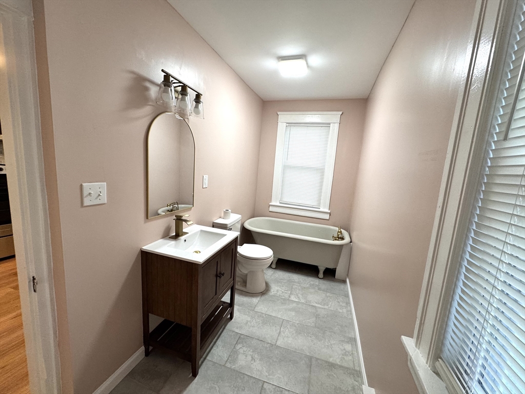 9 Idalla Avenue Worcester, MA 01606 - Photo 8 of 16 a bathroom with a toilet sink and mirror