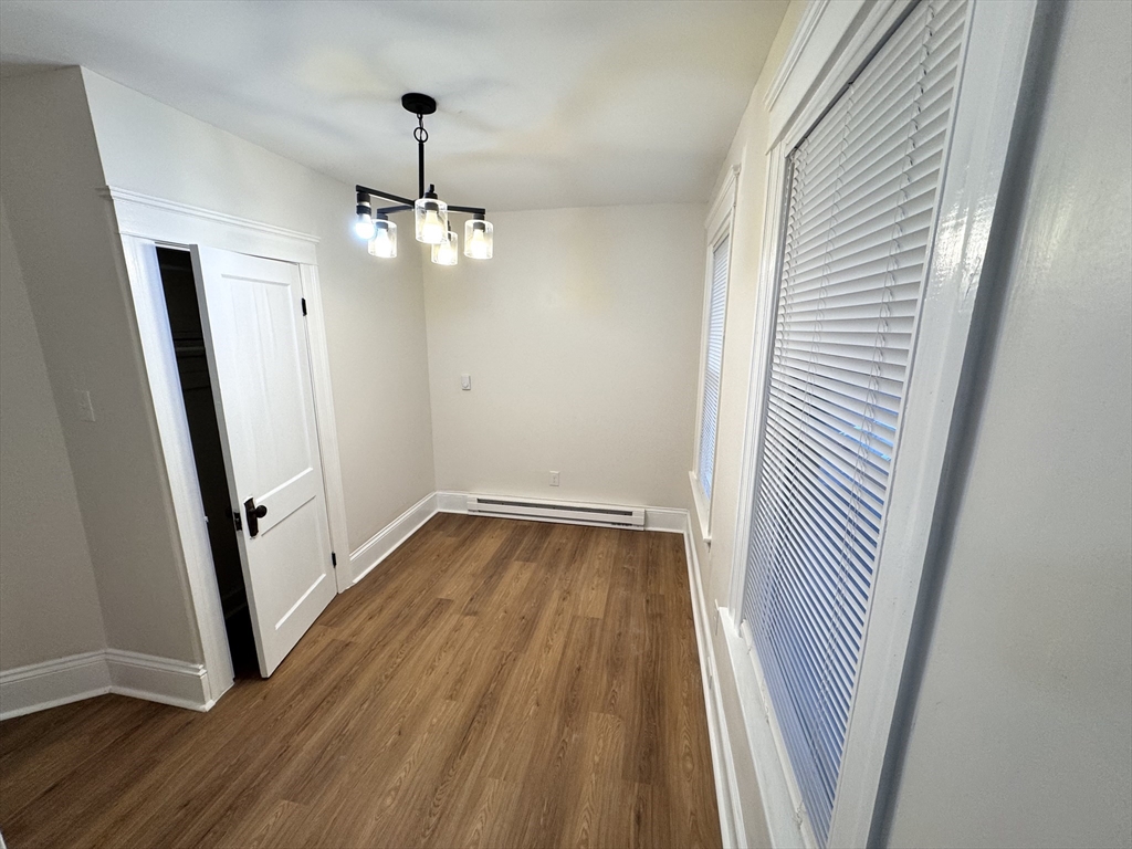 9 Idalla Avenue Worcester, MA 01606 - Photo 9 of 16 a view of a room with wooden floor and staircase