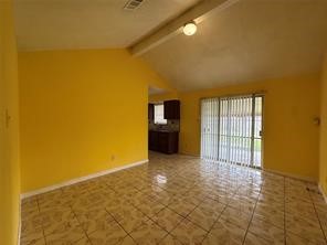 13907 Buffalo Speedway Houston, TX 77045 - Photo 4 of 14 a view of an empty room with a window