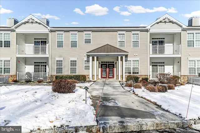 a front view of a building with many windows