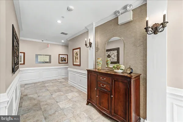 a spacious bathroom with a granite countertop sink a mirror and a bathtub