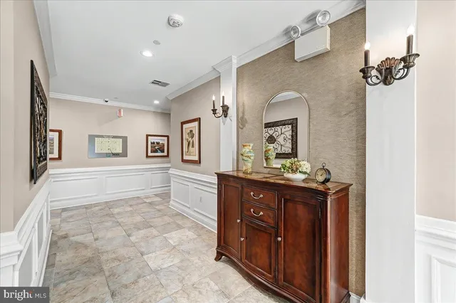 a spacious bathroom with a granite countertop sink a mirror and a bathtub