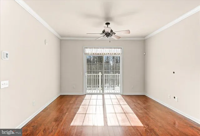 a view of a room with a large window