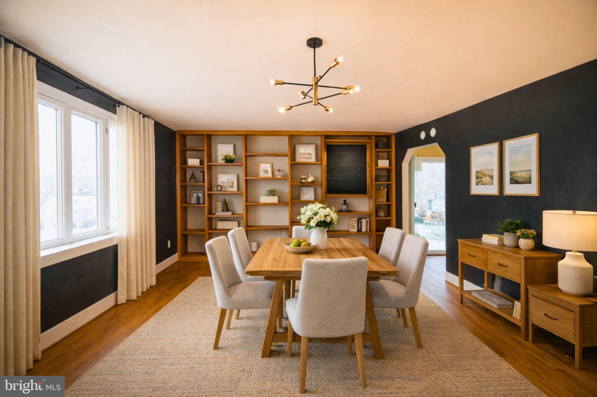 7920 Denton Drive Clinton, MD 20735 - Photo 11 of 34 a dining room with furniture a chandelier and wooden floor