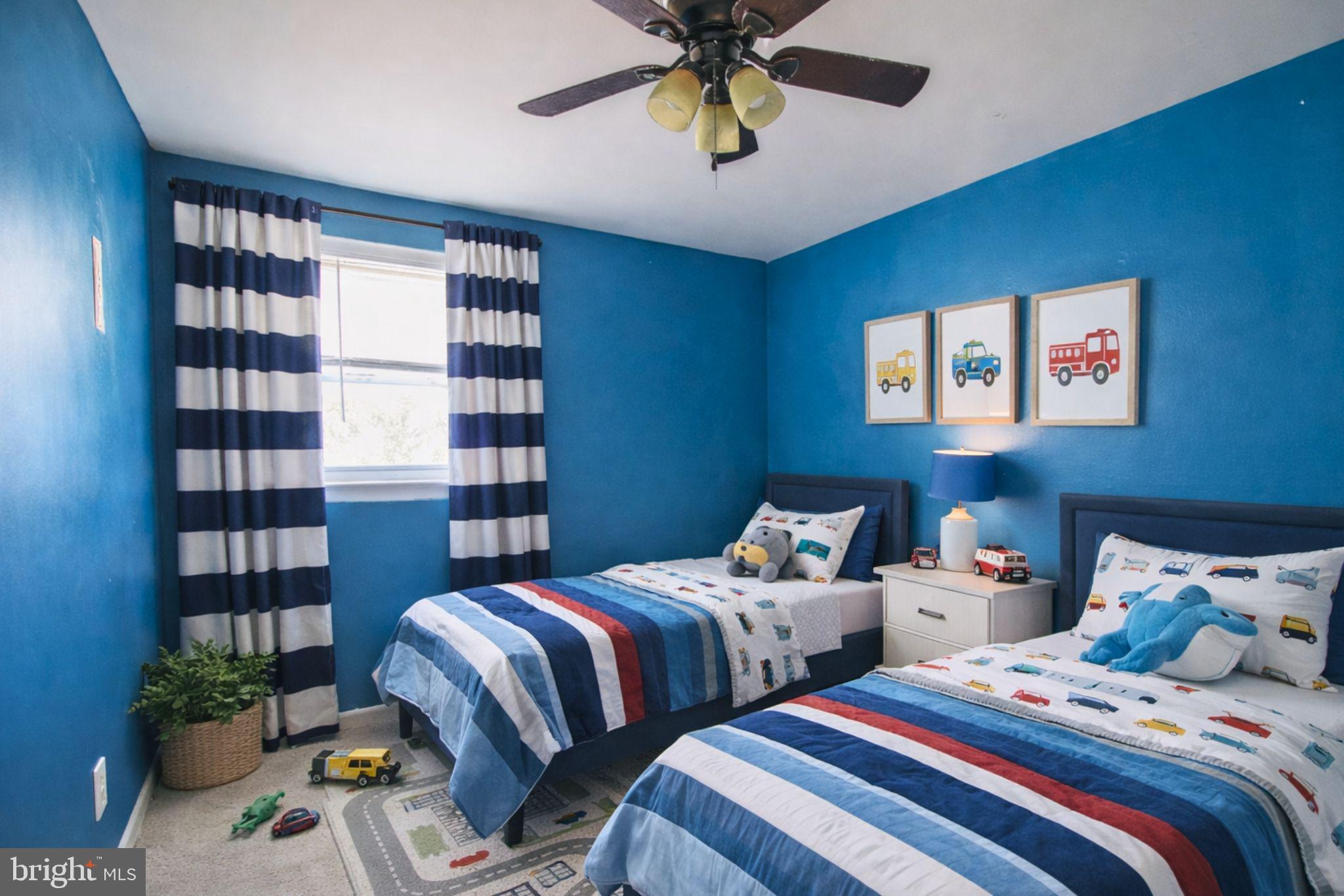 7920 Denton Drive Clinton, MD 20735 - Photo 21 of 34 a bedroom with two beds and a book shelf