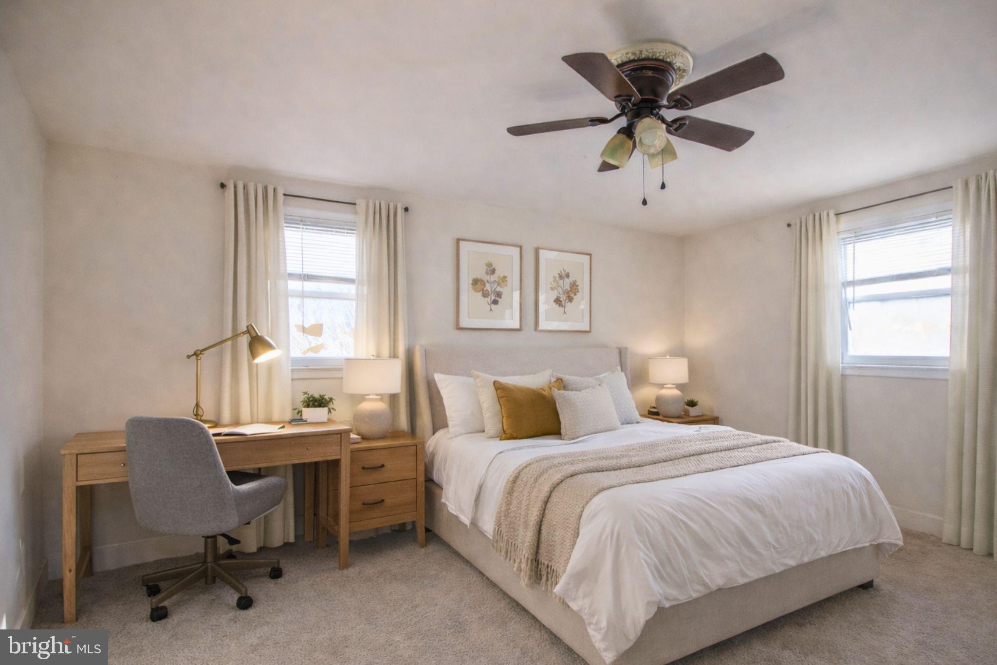 7920 Denton Drive Clinton, MD 20735 - Photo 24 of 34 a bedroom with a bed a desk and chair