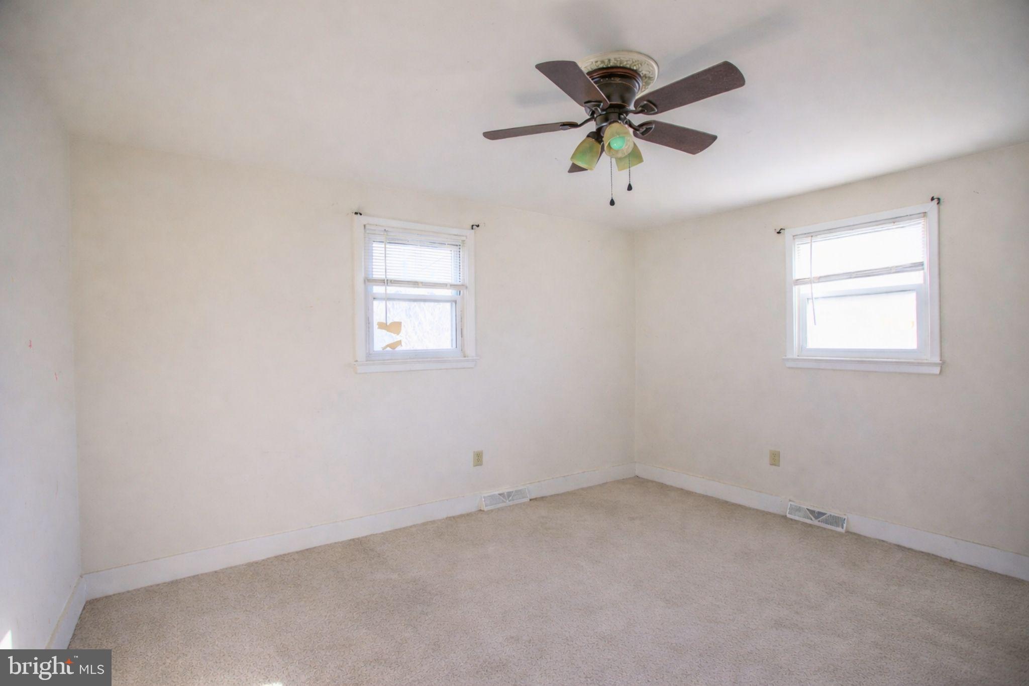 7920 Denton Drive Clinton, MD 20735 - Photo 27 of 34 an empty room with window and ceiling fan