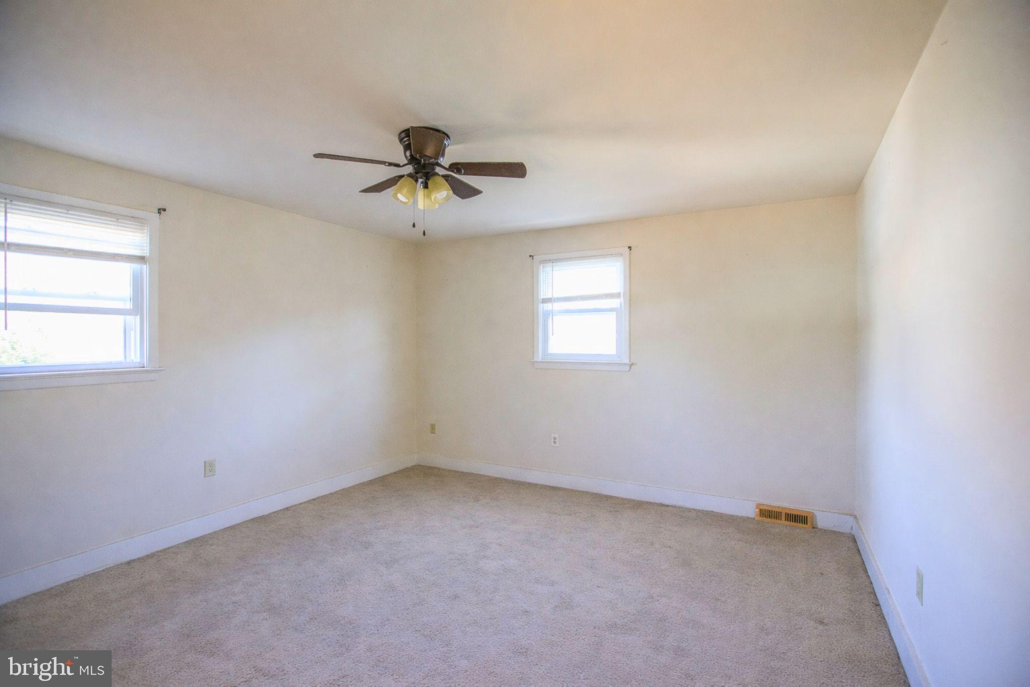 7920 Denton Drive Clinton, MD 20735 - Photo 30 of 34 a view of room with a ceiling fan and window
