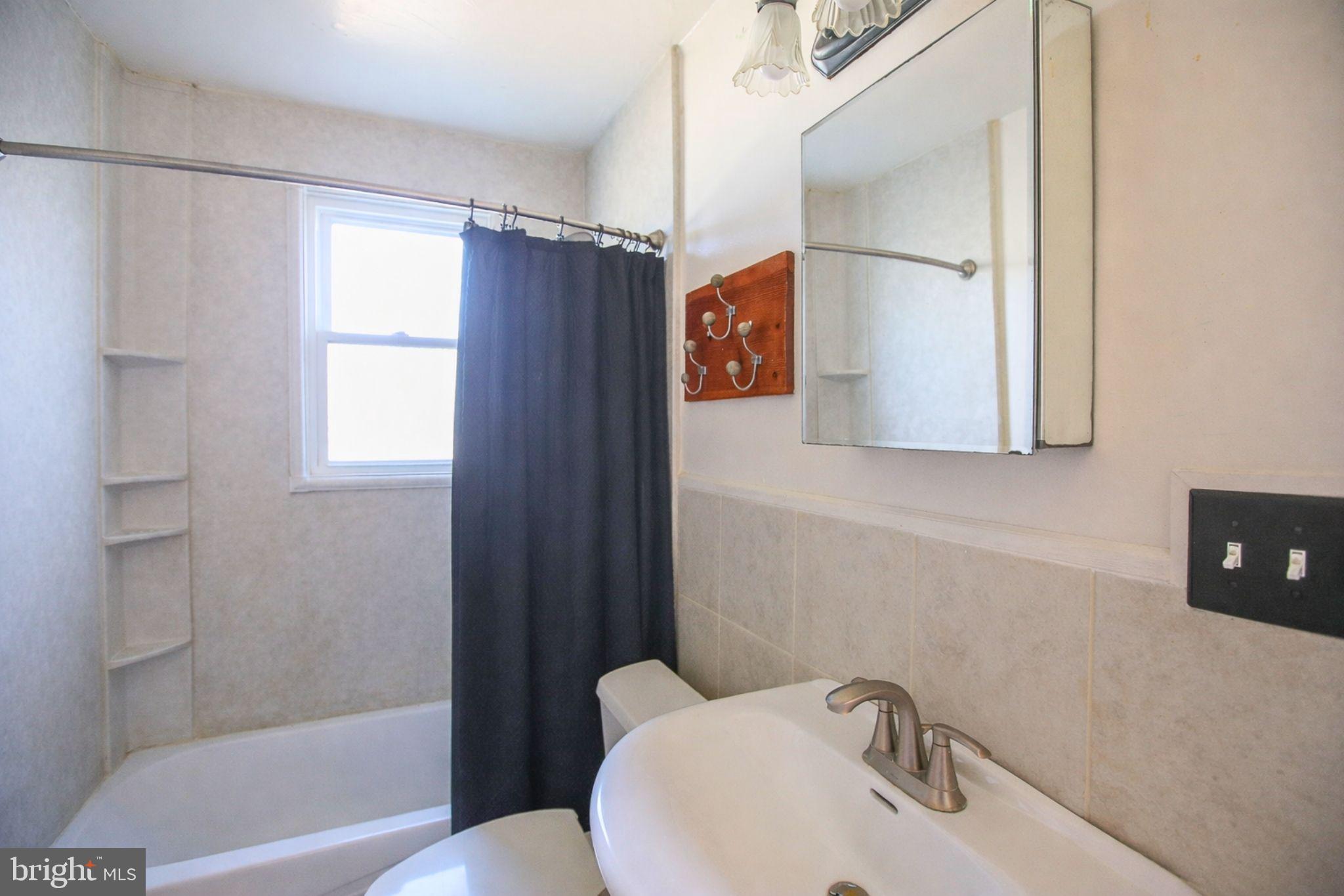 7920 Denton Drive Clinton, MD 20735 - Photo 31 of 34 a bathroom with a sink toilet and shower