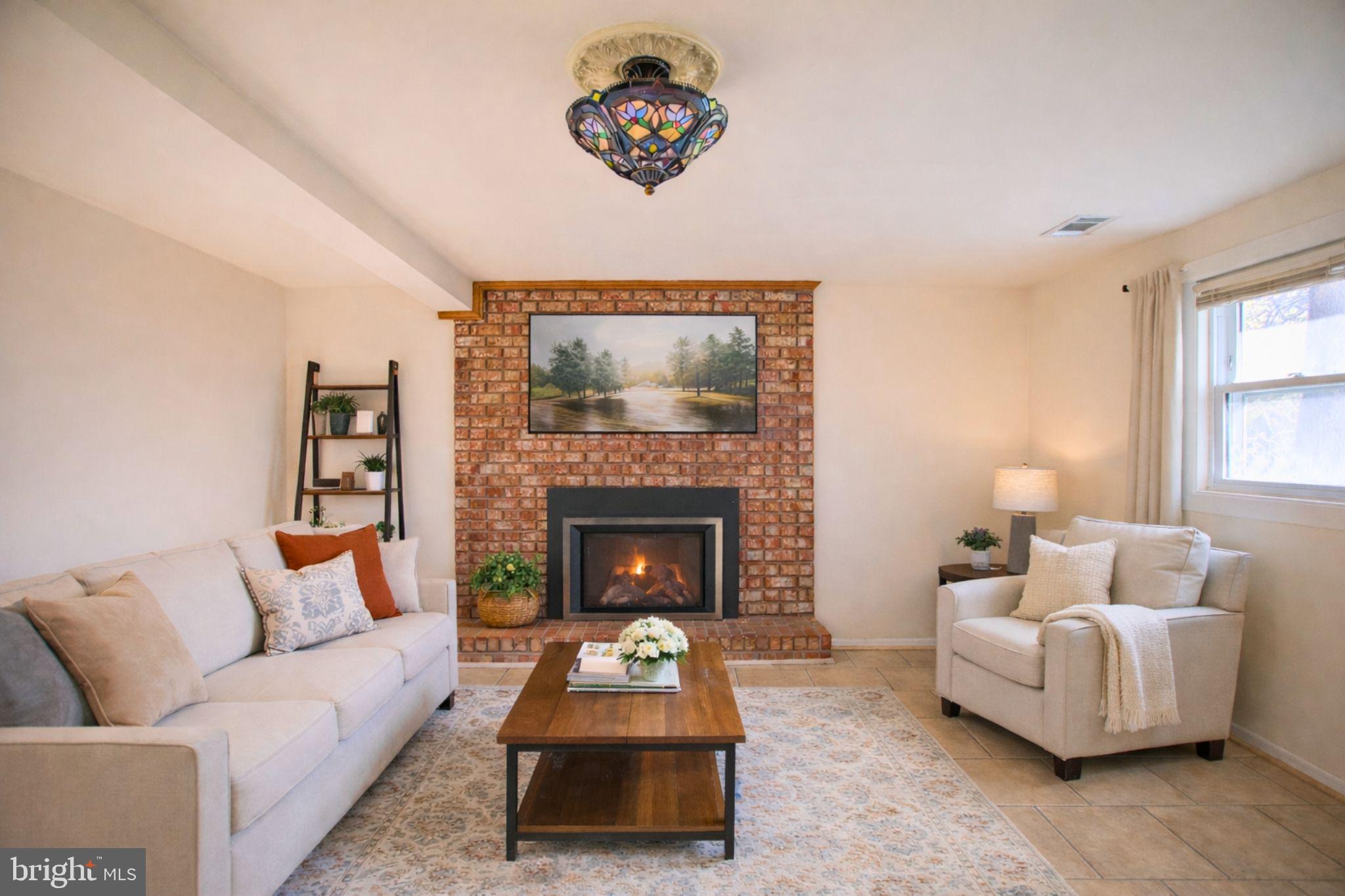 7920 Denton Drive Clinton, MD 20735 - Photo 4 of 34 a living room with furniture and a fireplace