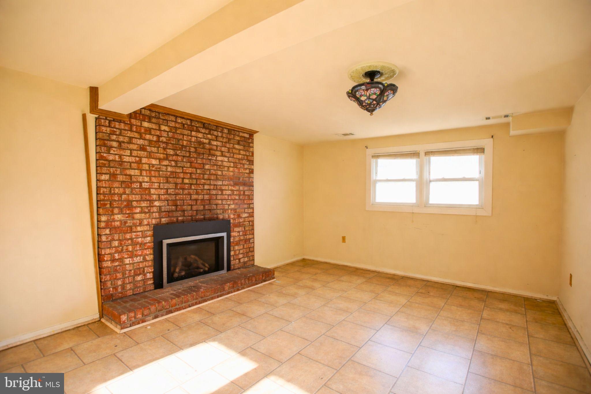 7920 Denton Drive Clinton, MD 20735 - Photo 6 of 34 a view of empty room with a fireplace