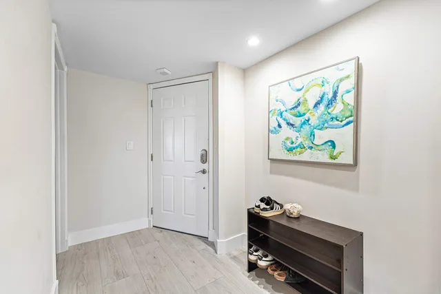 a room with painting on the wall and a painting on the wall