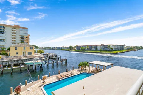 a view of a lake with tall buildings