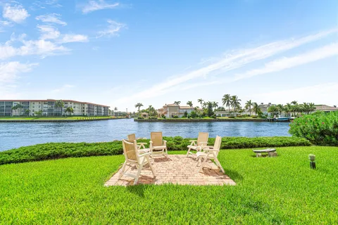 a view of a lake with houses in the back