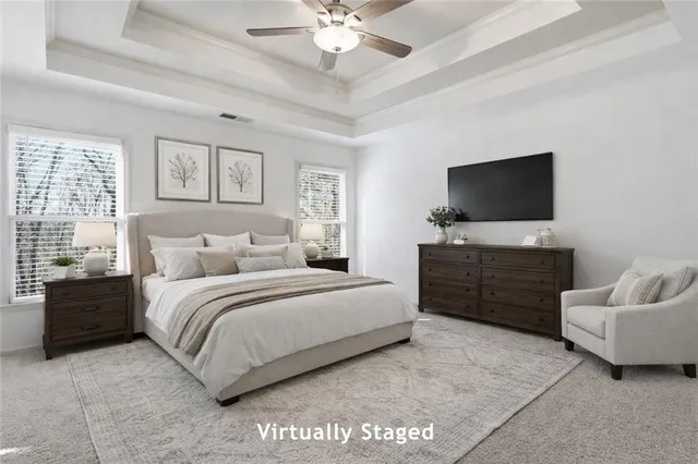 a bedroom with a bed and a flat screen television