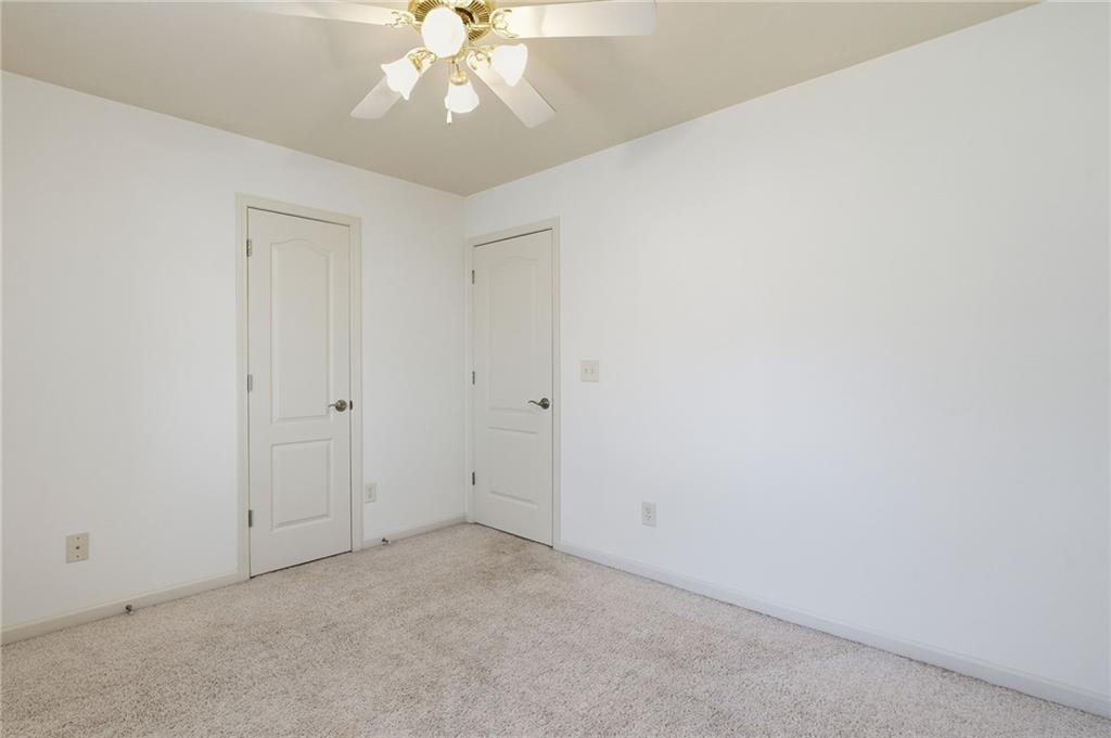 432 Barrel Way Ball Ground, GA 30107 - Photo 27 of 50 an empty room with a chandelier fan