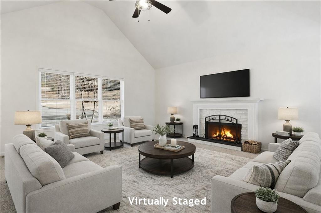 432 Barrel Way Ball Ground, GA 30107 - Photo 3 of 50 a living room with furniture a fireplace and a flat screen tv
