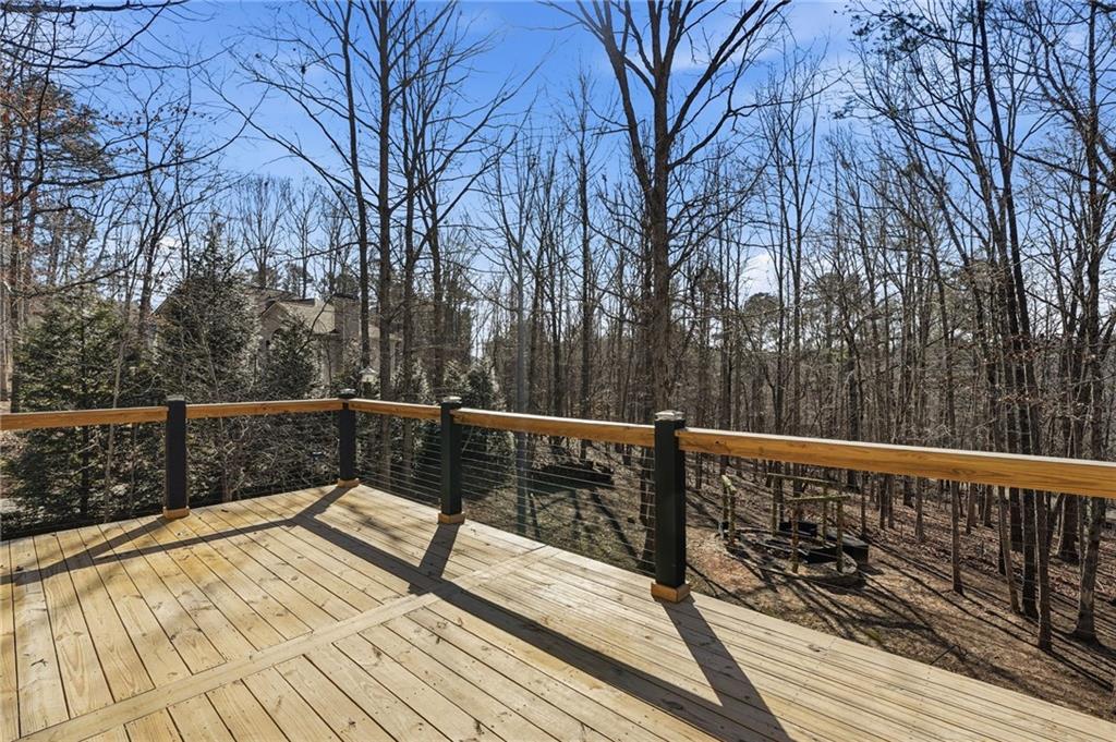 432 Barrel Way Ball Ground, GA 30107 - Photo 31 of 50 a view of balcony with wooden floor and fence