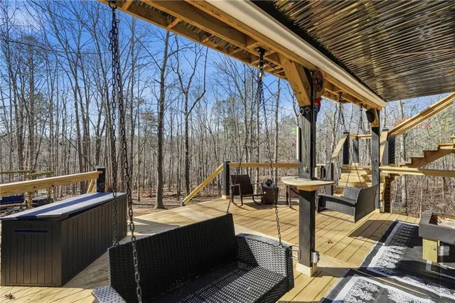 a view of a backyard with sitting area