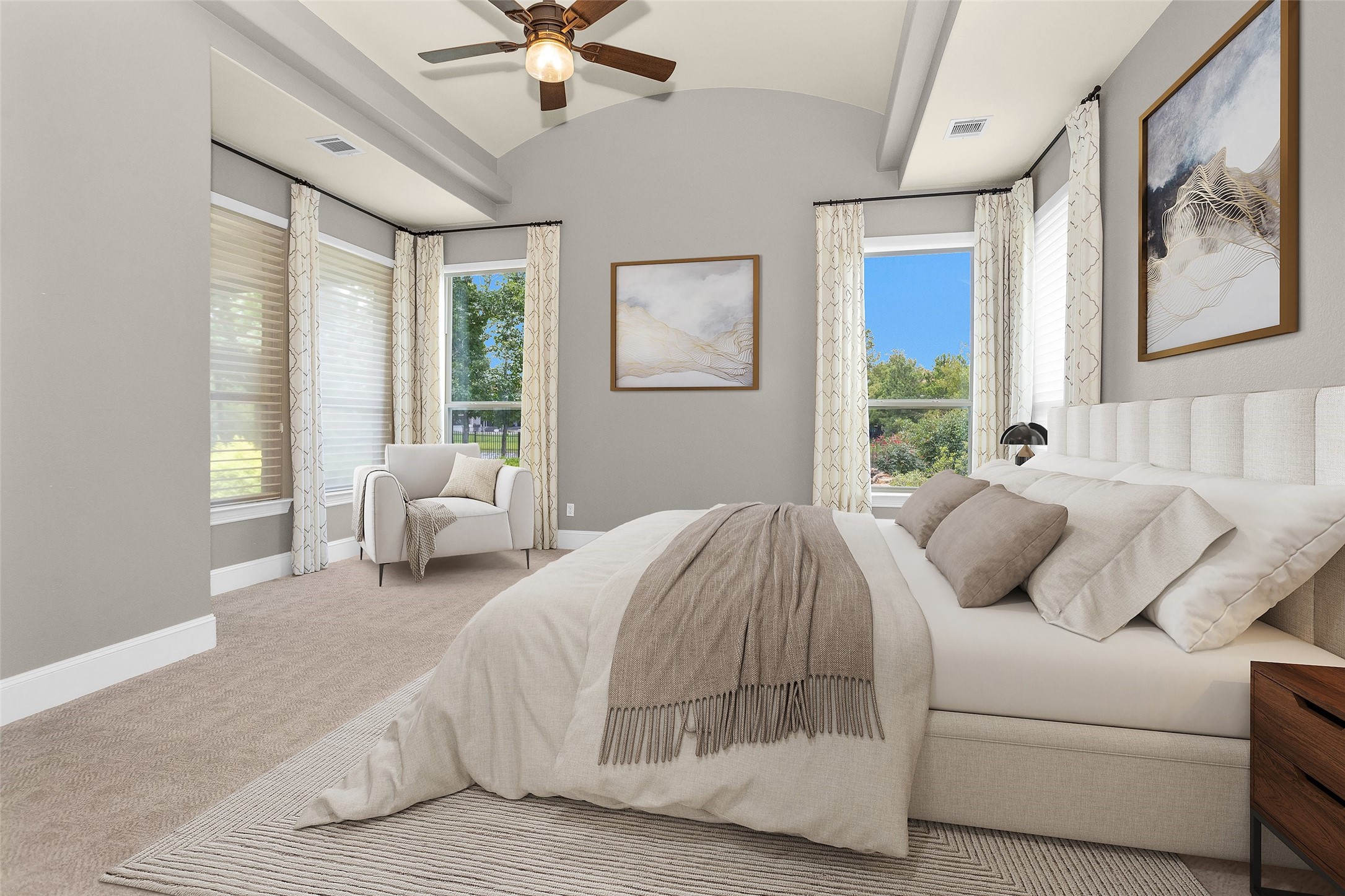 22 Marin Creek Place Spring, TX 77389 - Photo 12 of 36 Luxurious primary suite with tray ceilings and expansive windows showcasing serene lake views, creating a bright and tranquil retreat. *Virtually Staged*