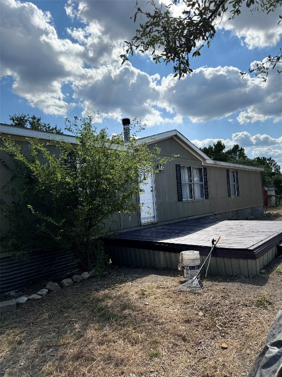 a view of house with backyard and garden