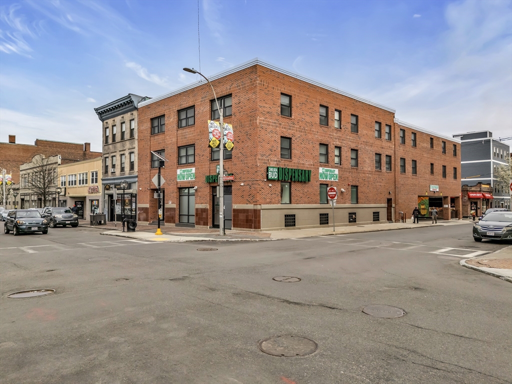 267 Broadway Chelsea, MA 02150 - Photo 2 of 30 a large building with a street