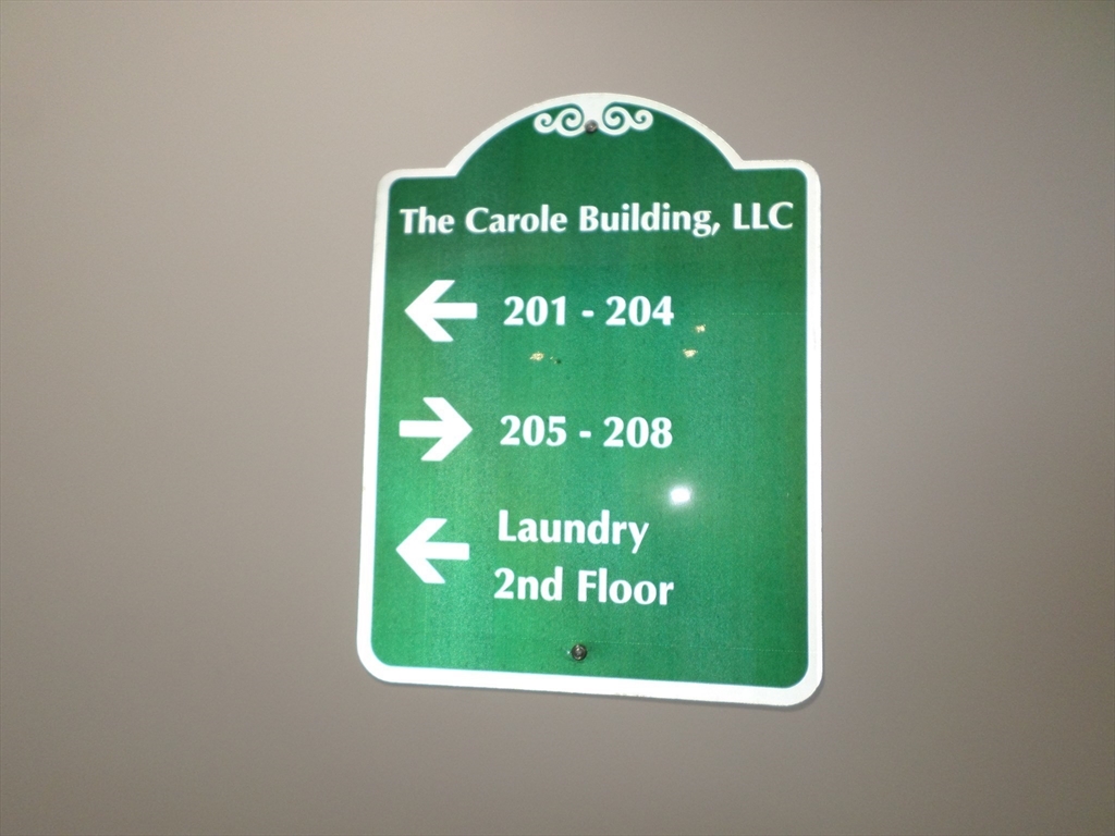 267 Broadway Chelsea, MA 02150 - Photo 24 of 30 a sign on the wall