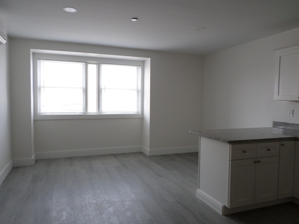 267 Broadway Chelsea, MA 02150 - Photo 9 of 30 an empty room with a window