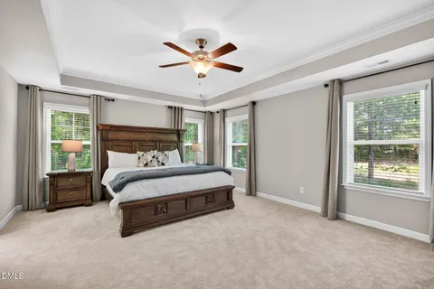 a spacious bedroom with a bed and window