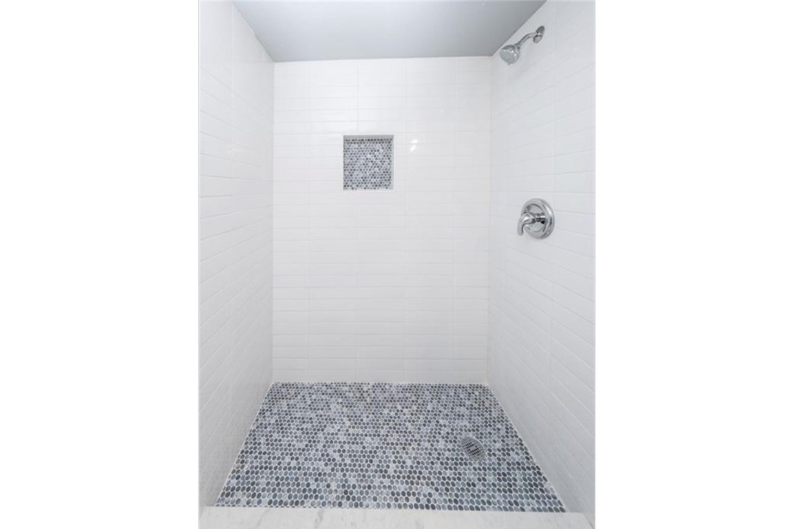 2610 Ektom Drive, Unit B Austin, TX 78745 - Photo 13 of 13 Bathroom featuring tiled shower