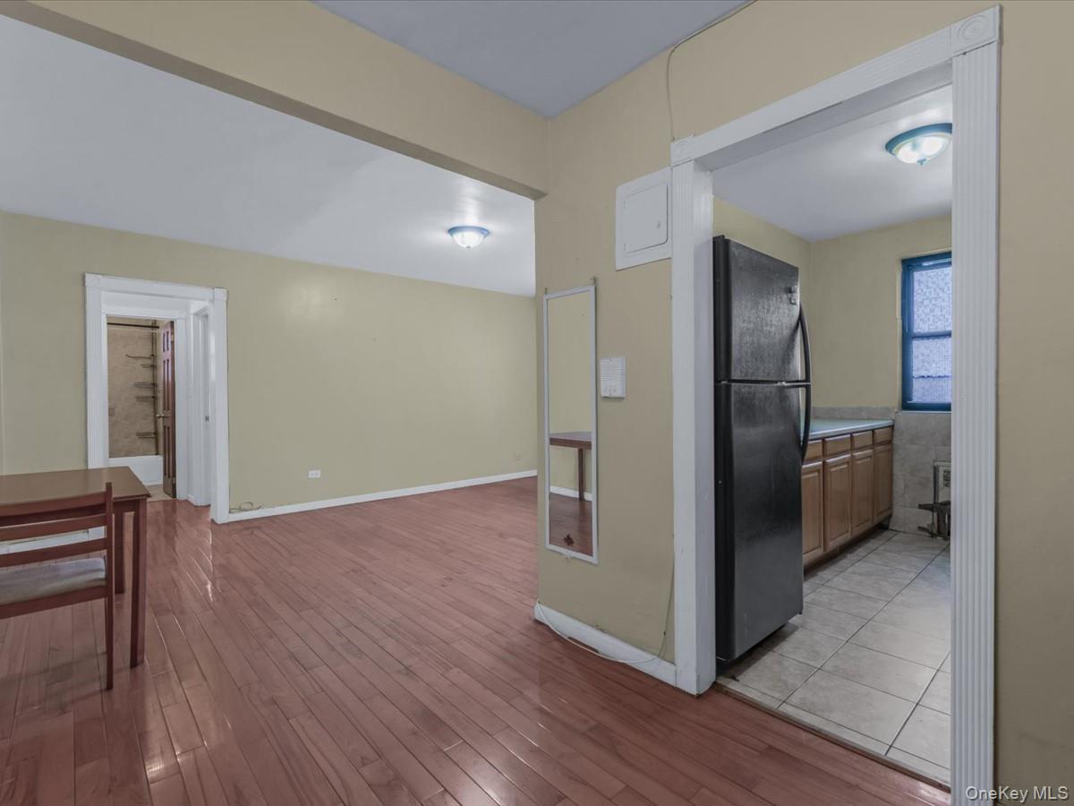 44-05 Macnish Street, Unit 1B Queens, NY 11373 - Photo 3 of 13 Hallway with light wood-type flooring and baseboards