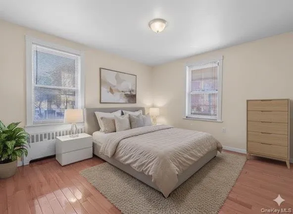 a bedroom with a large bed and a window